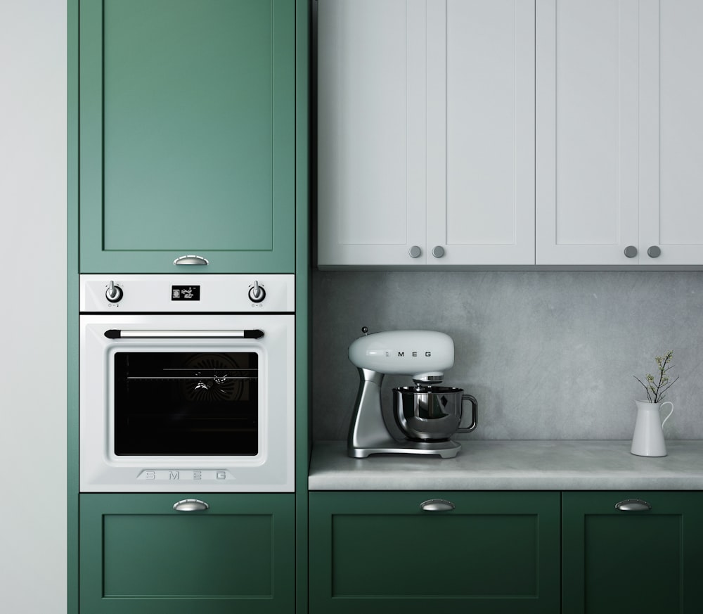 white and green cabinets.