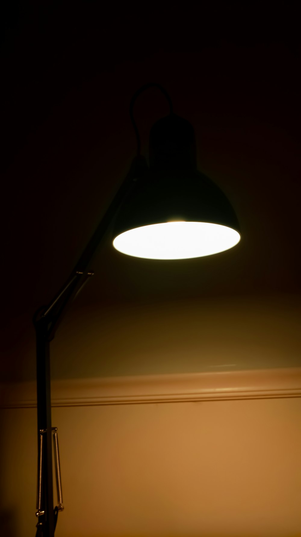 black pendant lamp turned on in room