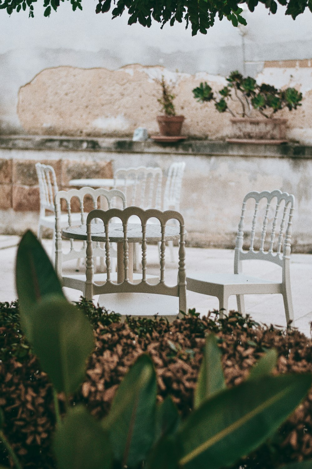 white plastic chairs on white concrete stairs