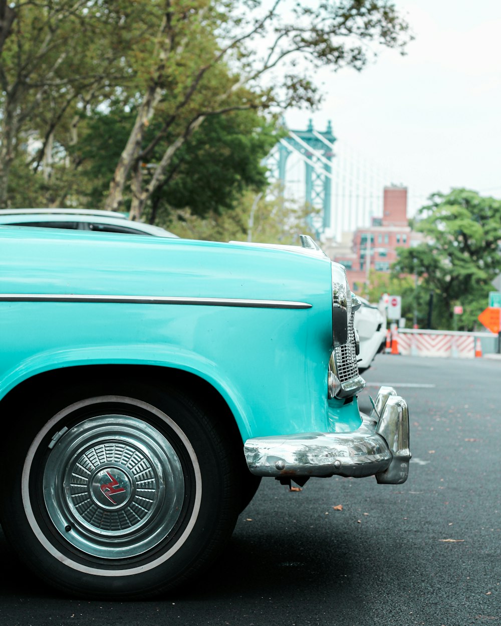 blue car on the road during daytime