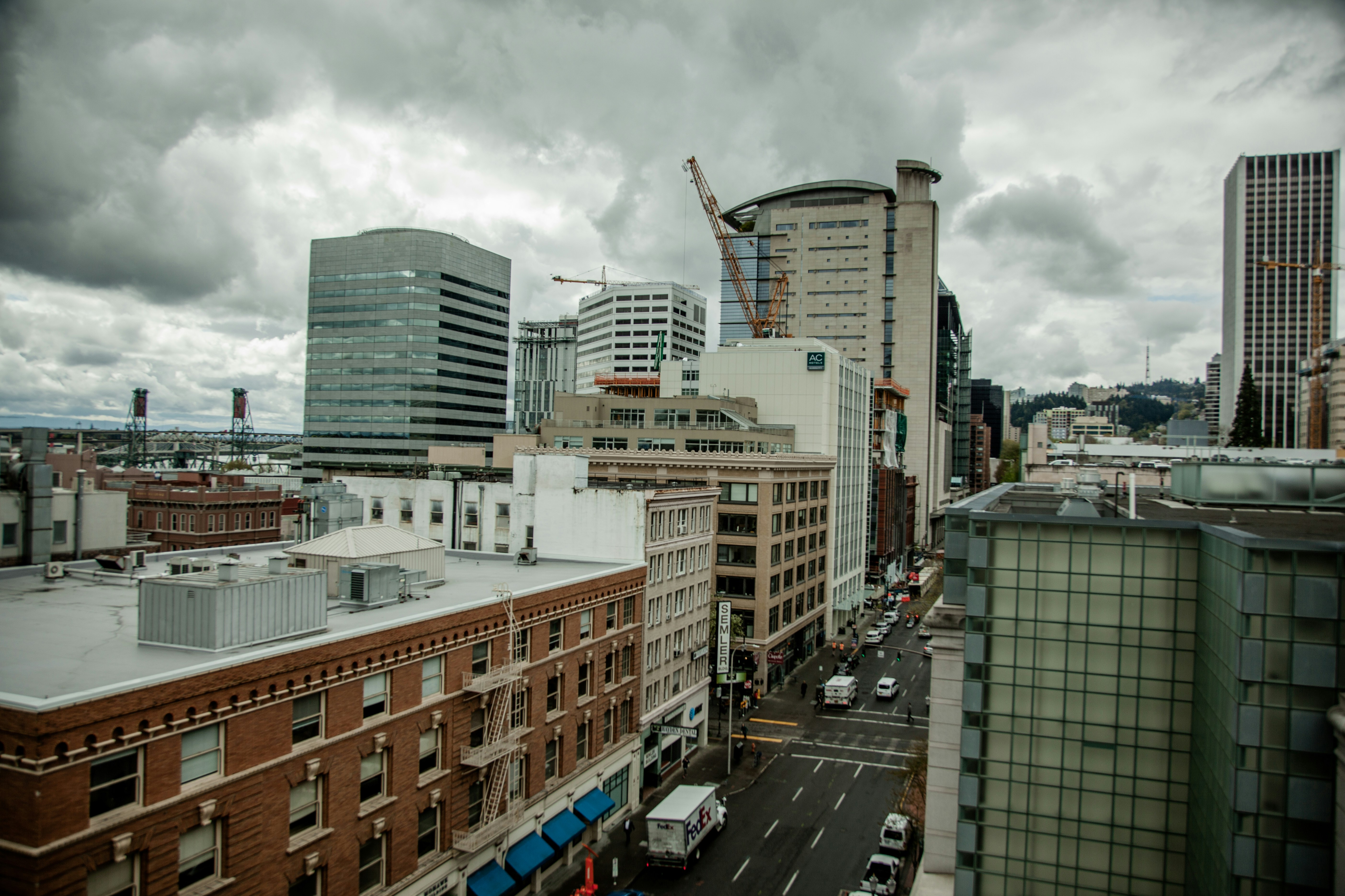 cars parked on parking lot near high rise buildings during daytime, Downtown Portland