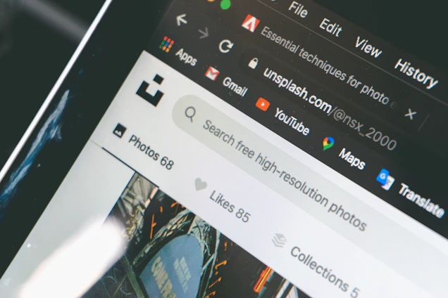 A sleek, modern search bar with a grid of vibrant, high-quality images displayed below on a clean white background.