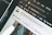 Close-up of a computer screen displaying an open web browser with multiple tabs, including a tab showing the Unsplash website. Other visible icons include web apps like Gmail, YouTube, and Maps. The search bar on the page invites users to look for free high-resolution photos.