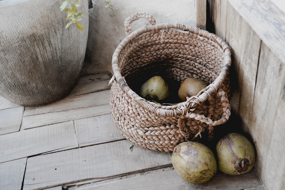 brown woven basket with apple fruits