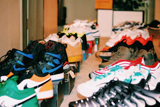 assorted shoes on green and white chairs