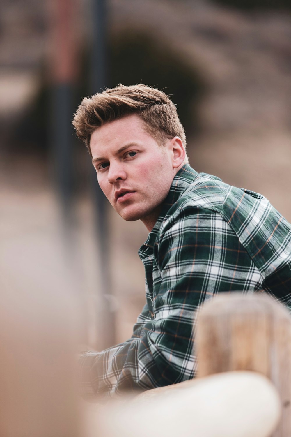 man in black and white plaid dress shirt