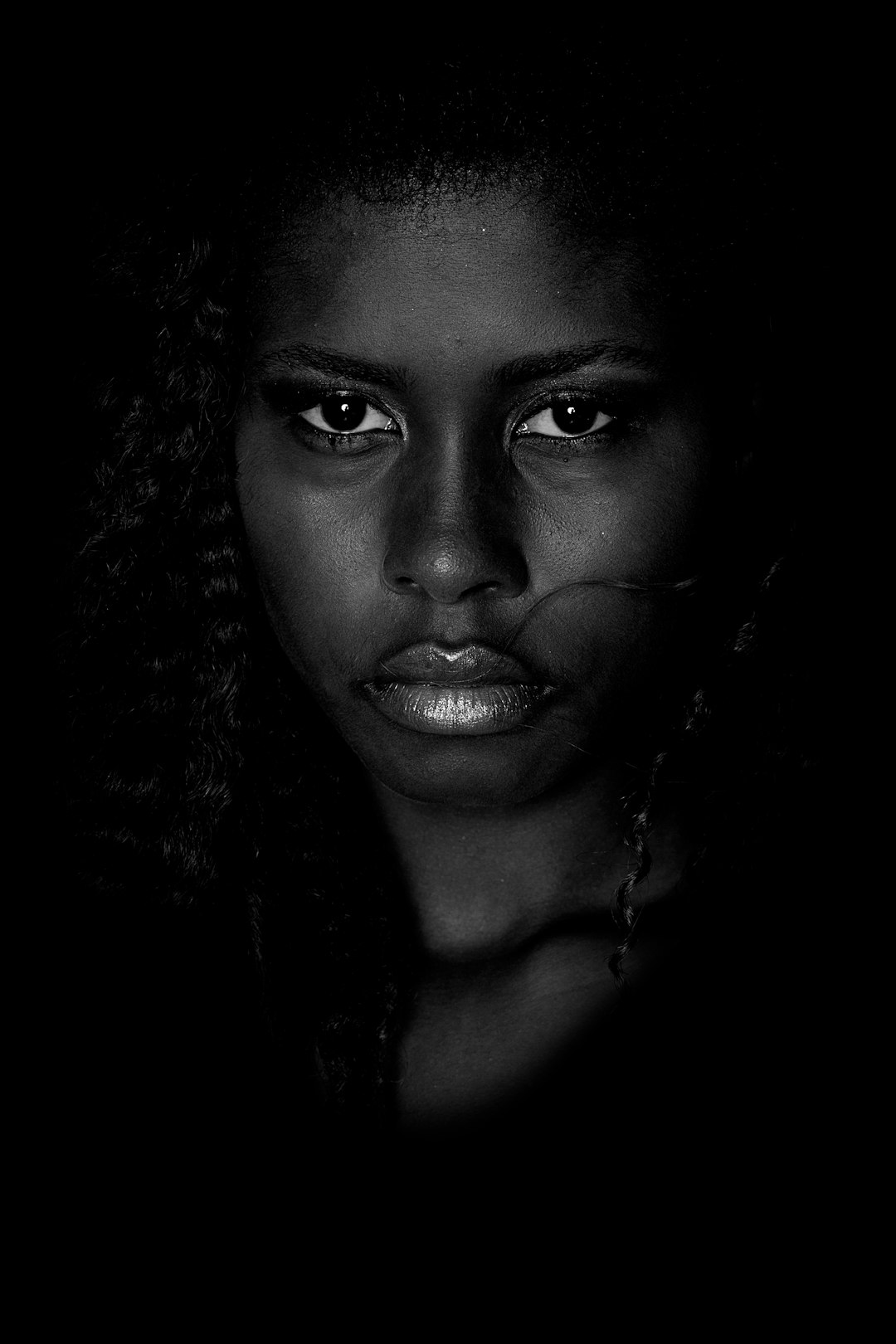 grayscale photo of woman with silver necklace