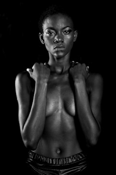 topless woman with black background