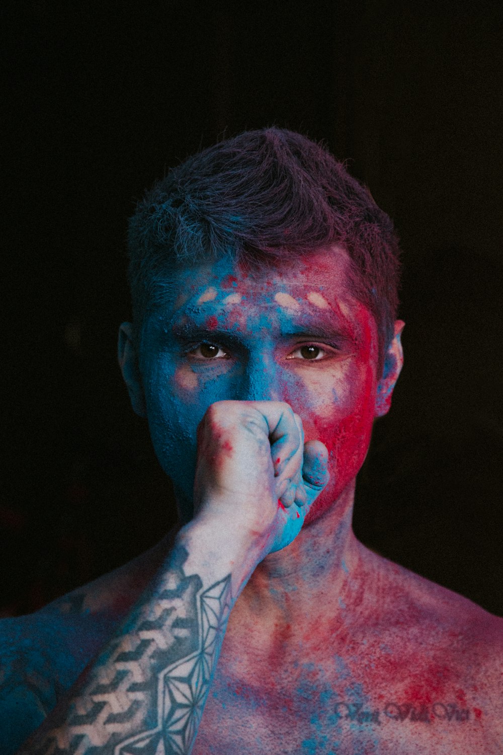 man with blue paint on face