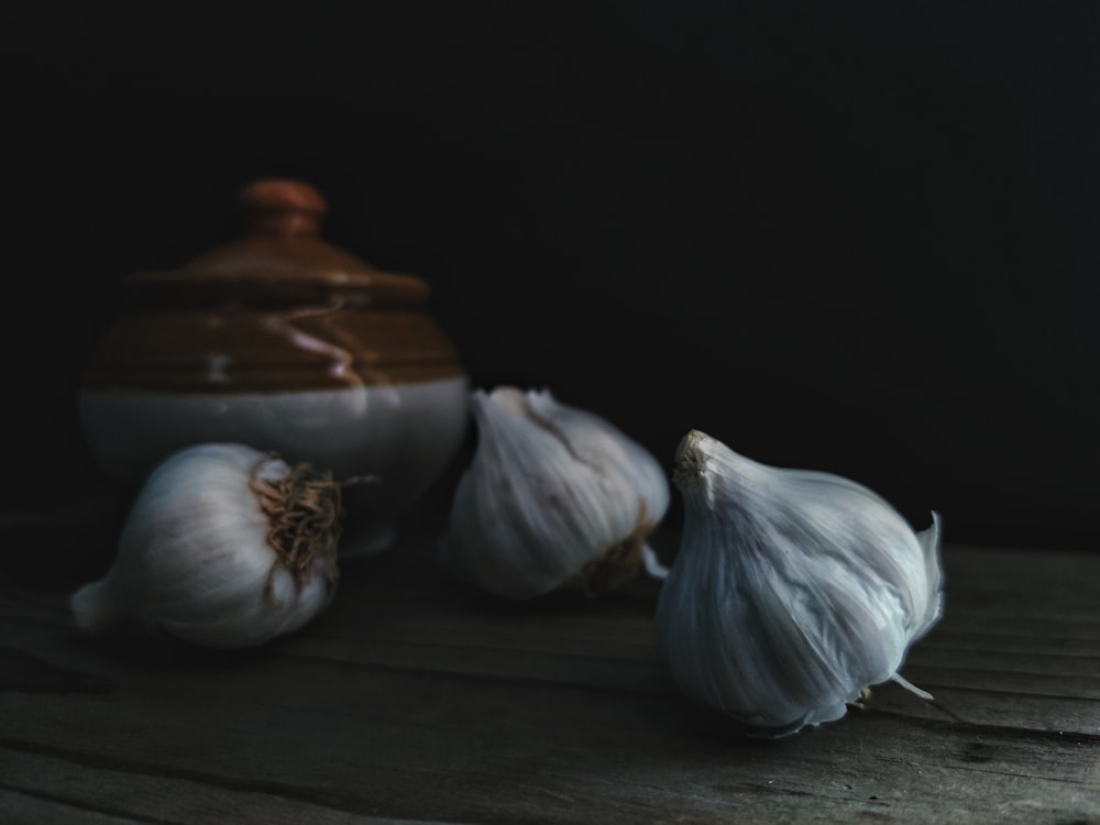 garlic on brown wooden table