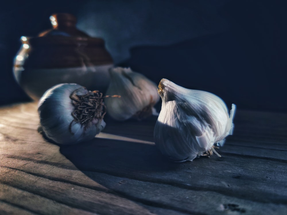 garlic on brown wooden table