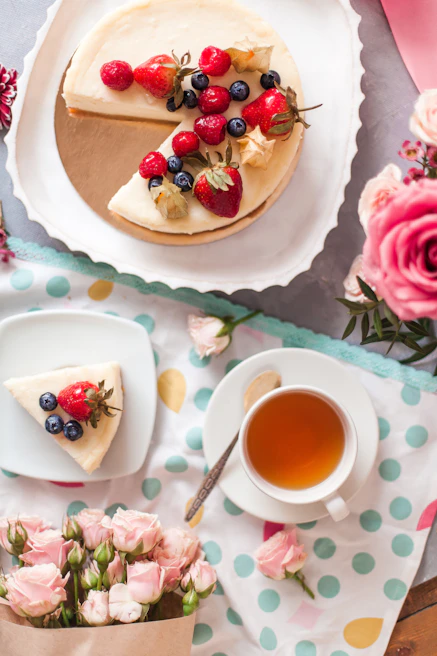 A beautifully arranged cheesecake platter with assorted flavors and colorful toppings, ready for a celebration