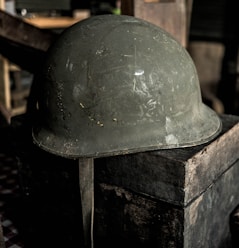 grey helmet on brown wooden table