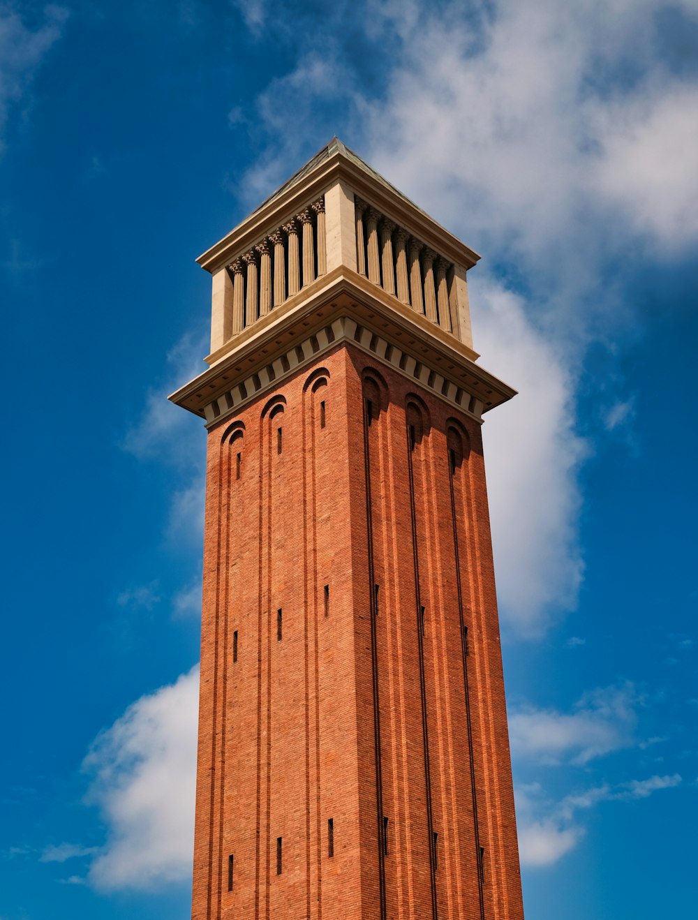 brown concrete tower under blue sky