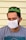 man in gray crew neck shirt wearing white green and yellow knit cap