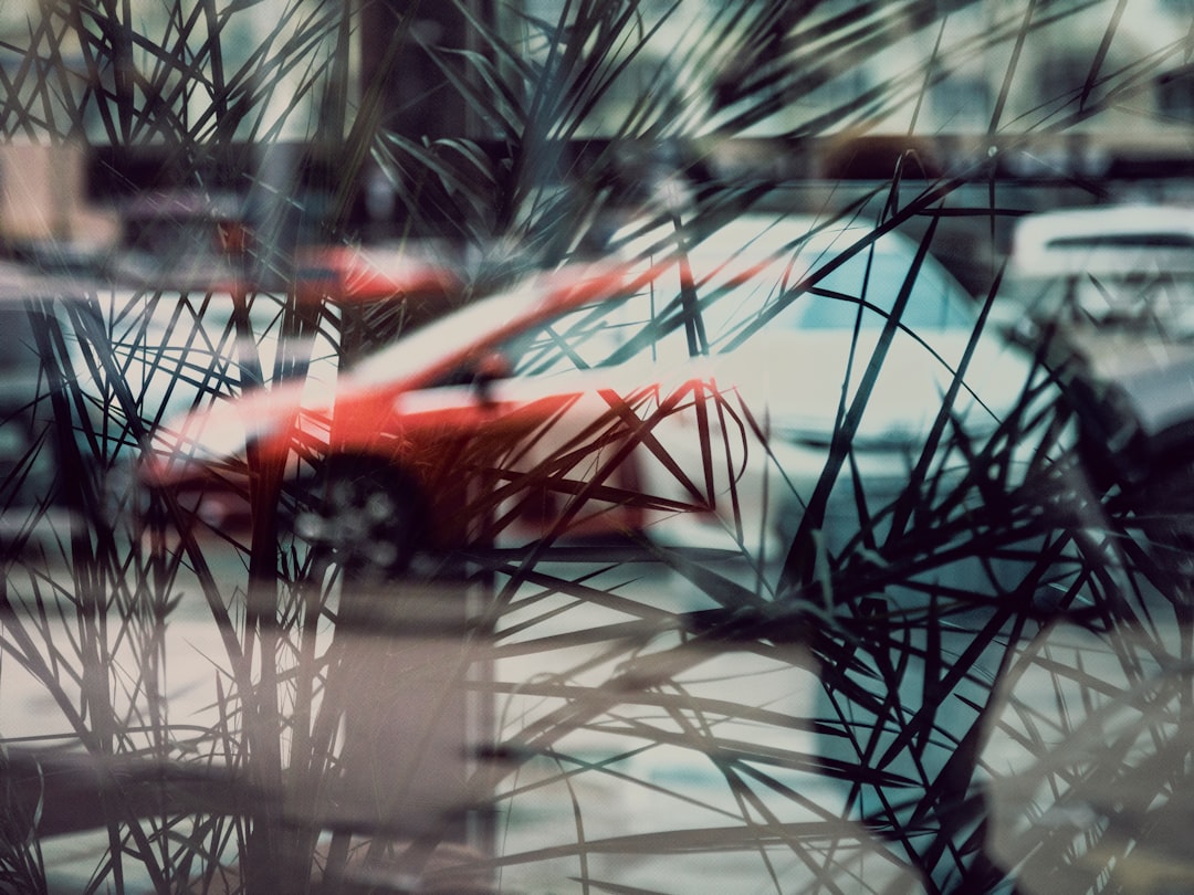 red car on road during daytime