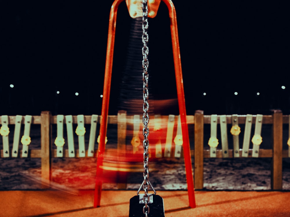 brown swing chair on brown sand during night time