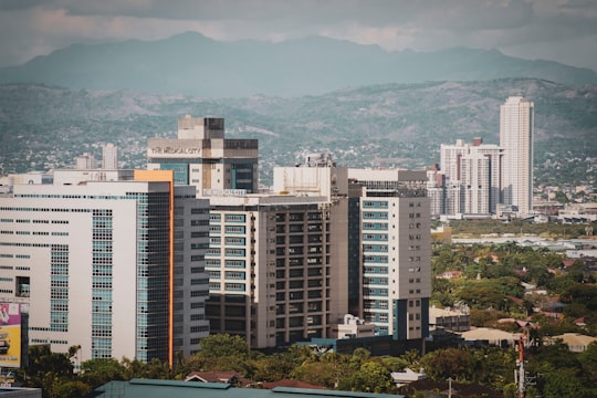 white and blue concrete building during daytime in Pasig Philippines