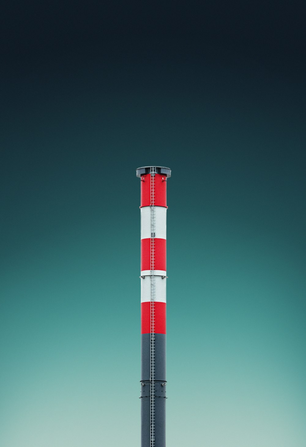 red and white tower under blue sky