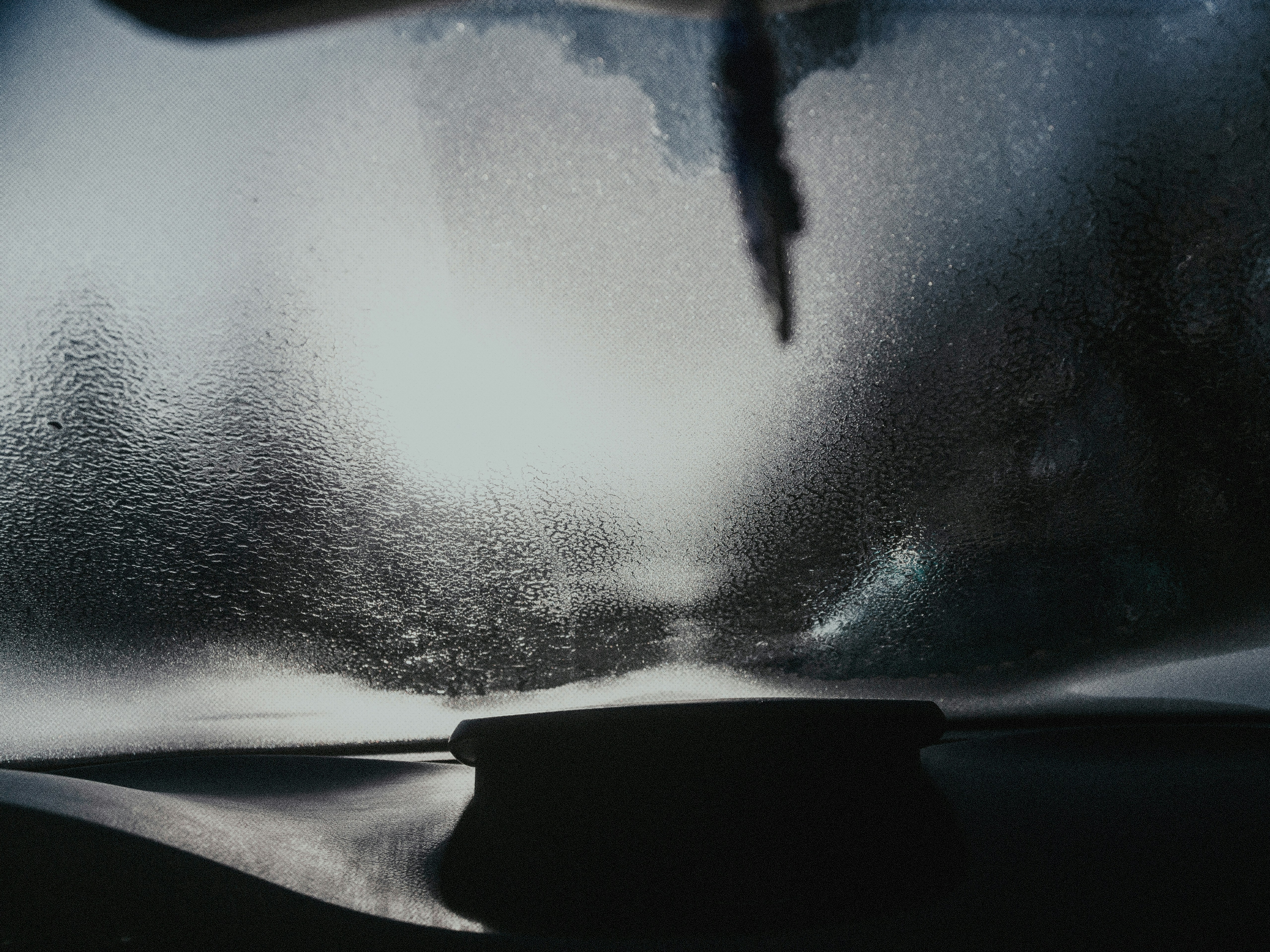 water beading flawlessly on a ceramic-coated car - water spot removal