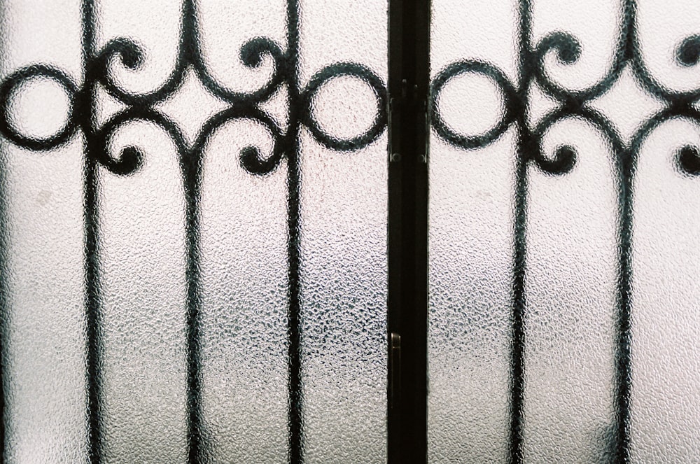 black metal gate with white snow