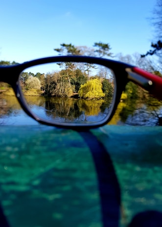 A serene outdoor scene with a person enjoying nature, symbolizing eye health and clarity.