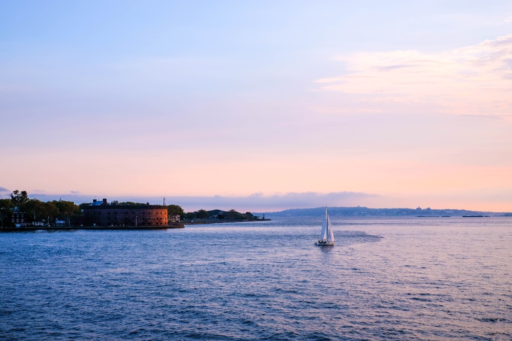 white sailboat on sea during daytime