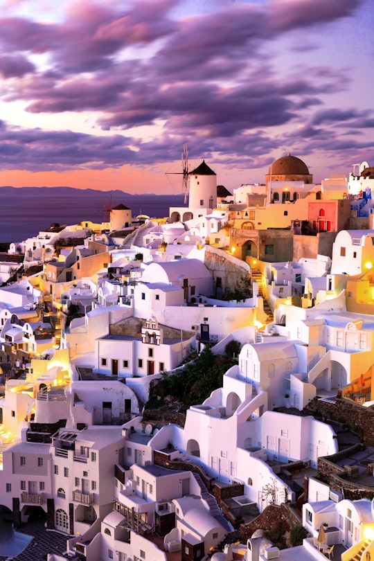 white and brown concrete houses during daytime in Thíra Greece