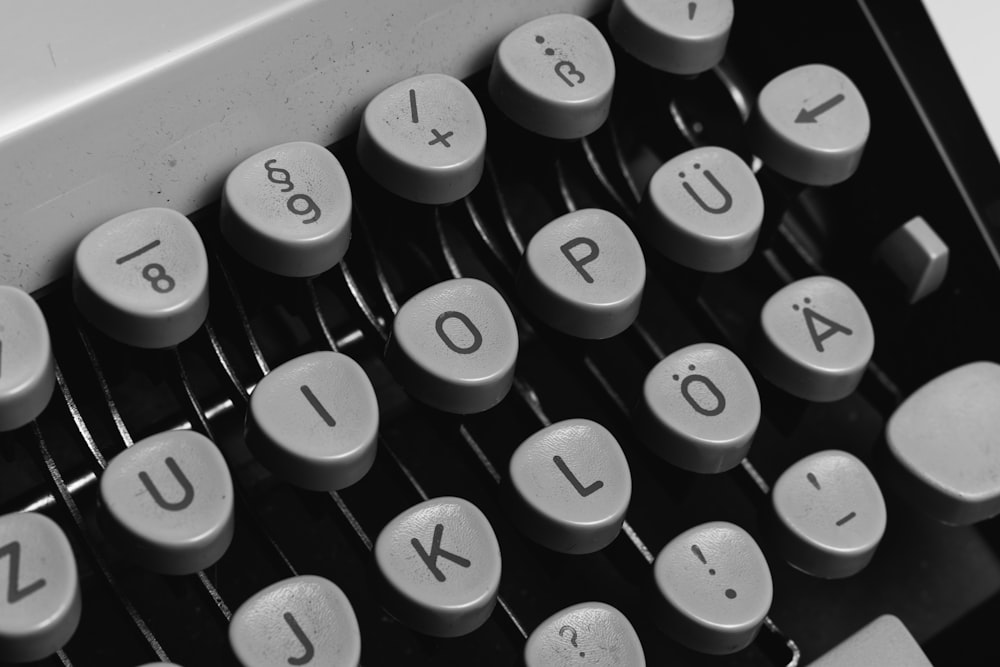 black and white typewriter keyboard
