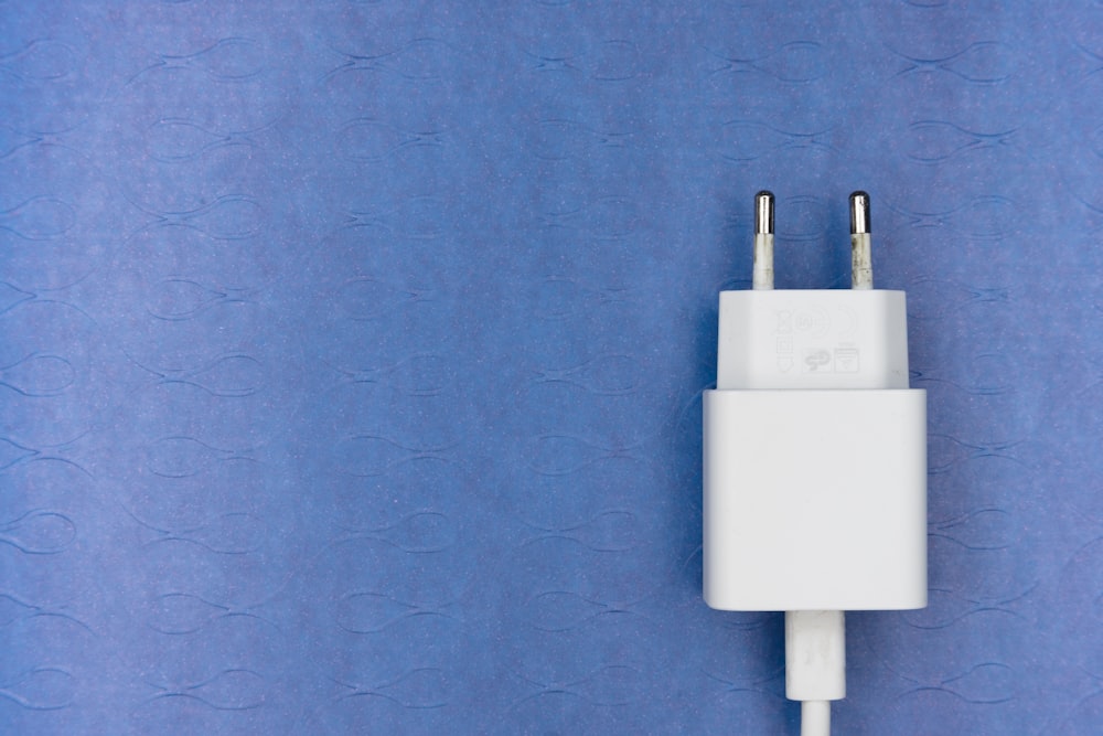 white adapter on purple textile
