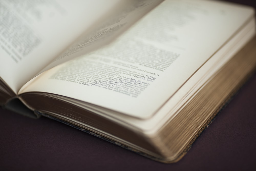 white book page on brown wooden table