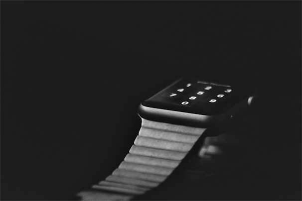 Close-up of a smartwatch with a glowing blue interface highlighting its features