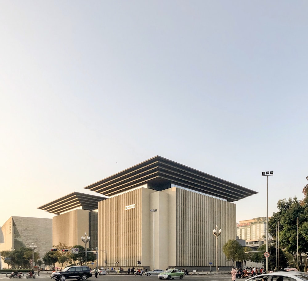 white concrete building near green trees during daytime