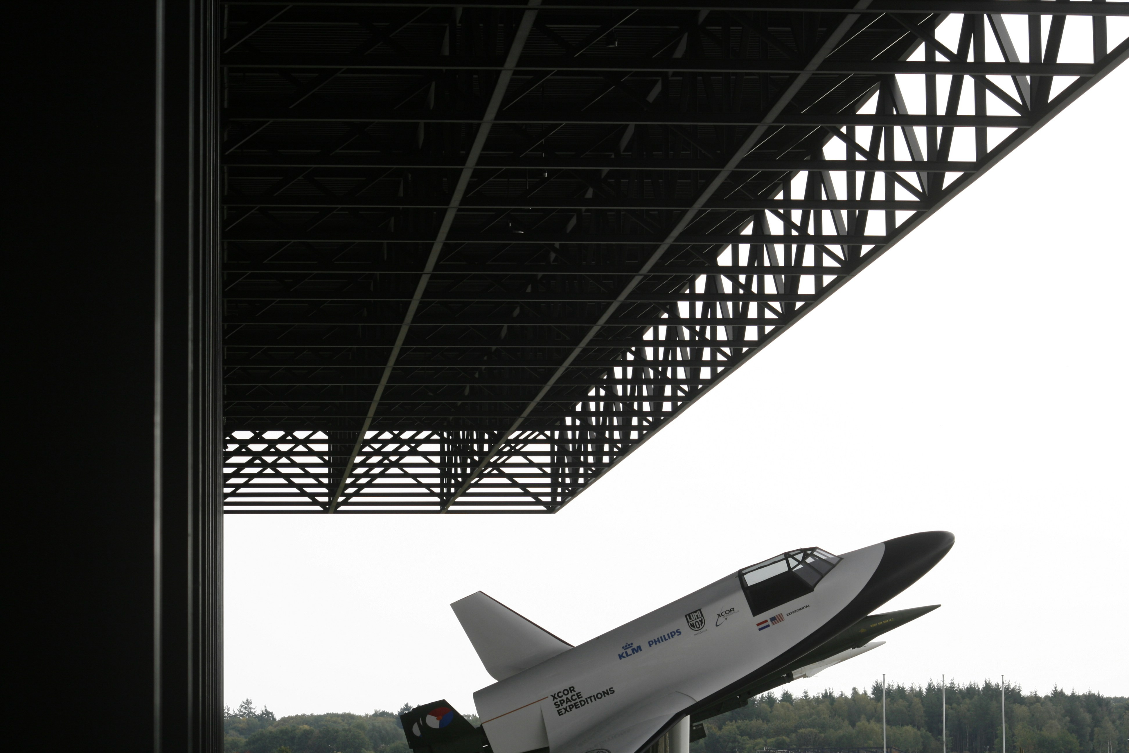 white and red airplane on the sky during daytime