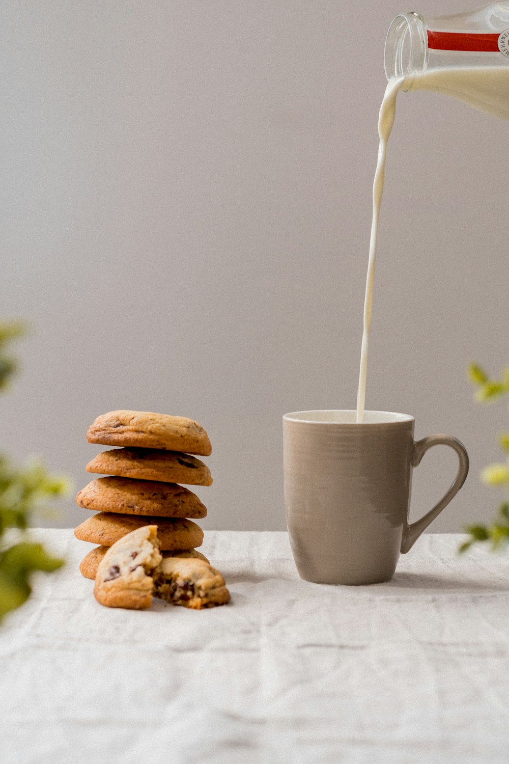 white ceramic mug with white straw