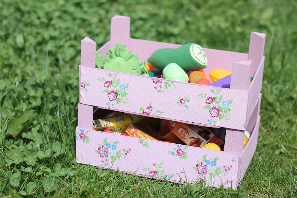 green and yellow egg on pink and white floral box