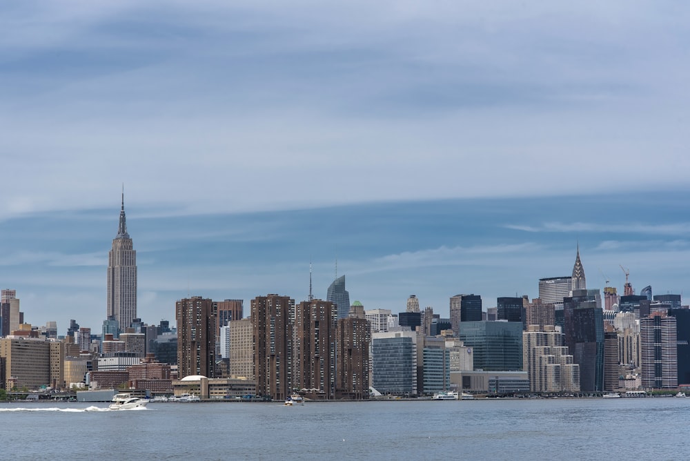 city skyline across body of water during daytime