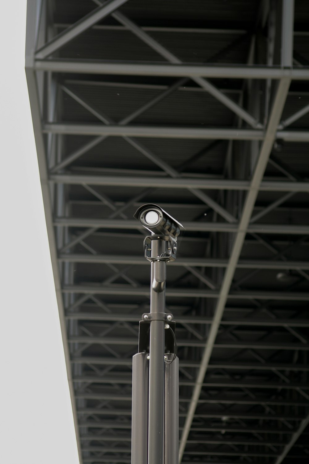 silver and black microphone with stand