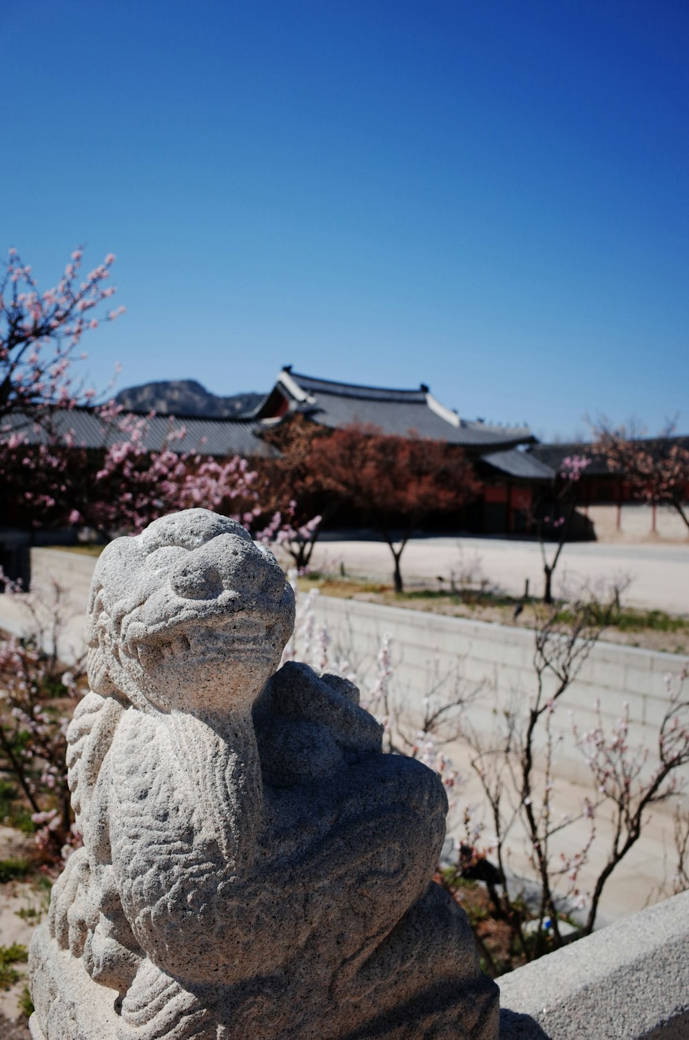 gray concrete statue on gray rock