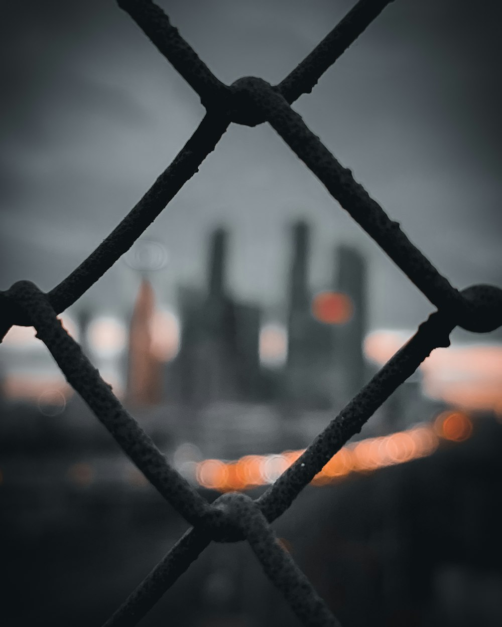 black metal fence during sunset