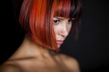 Close-up of a vibrant hair color transformation in a modern salon setting