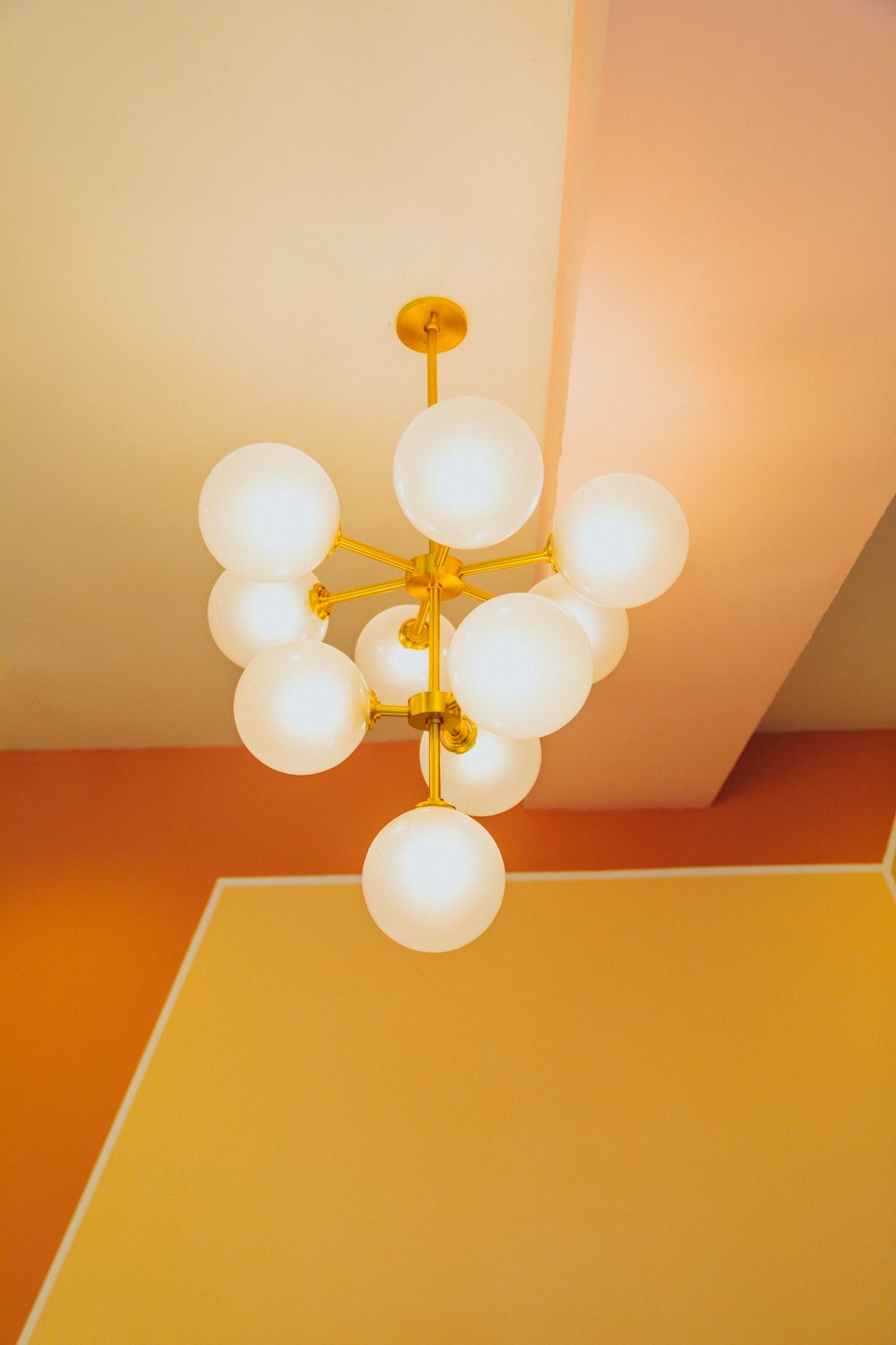 white and gold balloons on ceiling