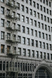 Inspection of a building facade showing structural details and safety checks.