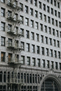 Inspection of a building facade showing structural details and safety checks.