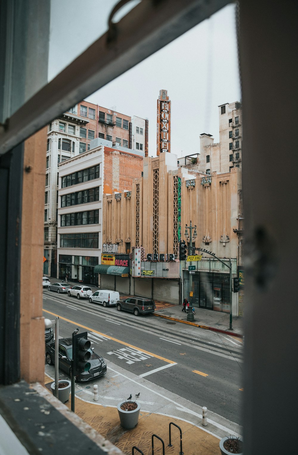 cars on road near buildings during daytime