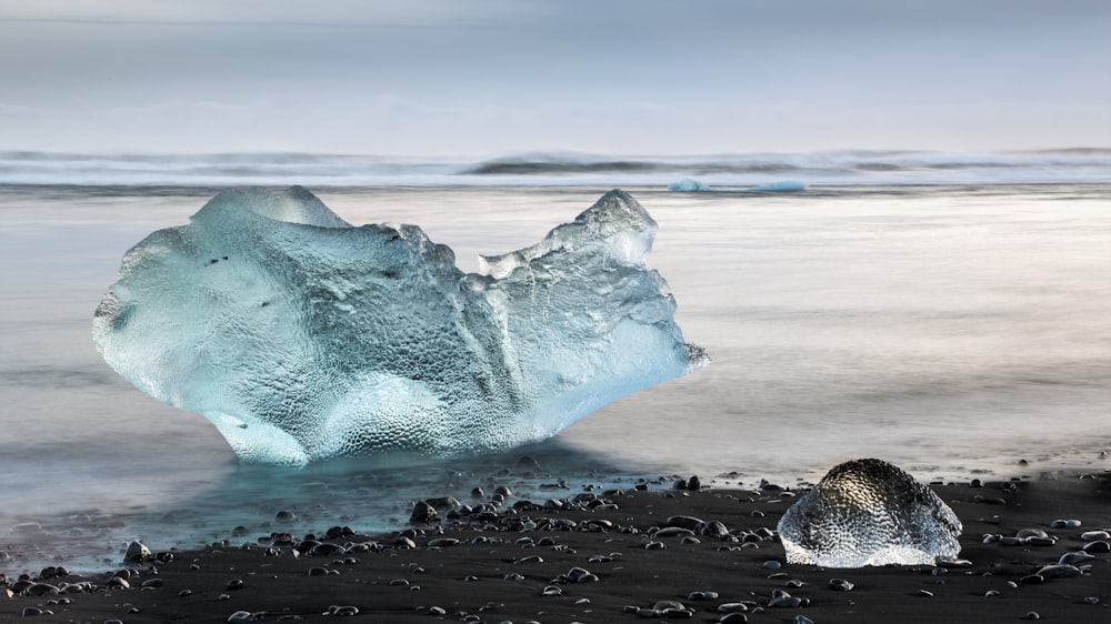 brown rock formation on beach during daytime