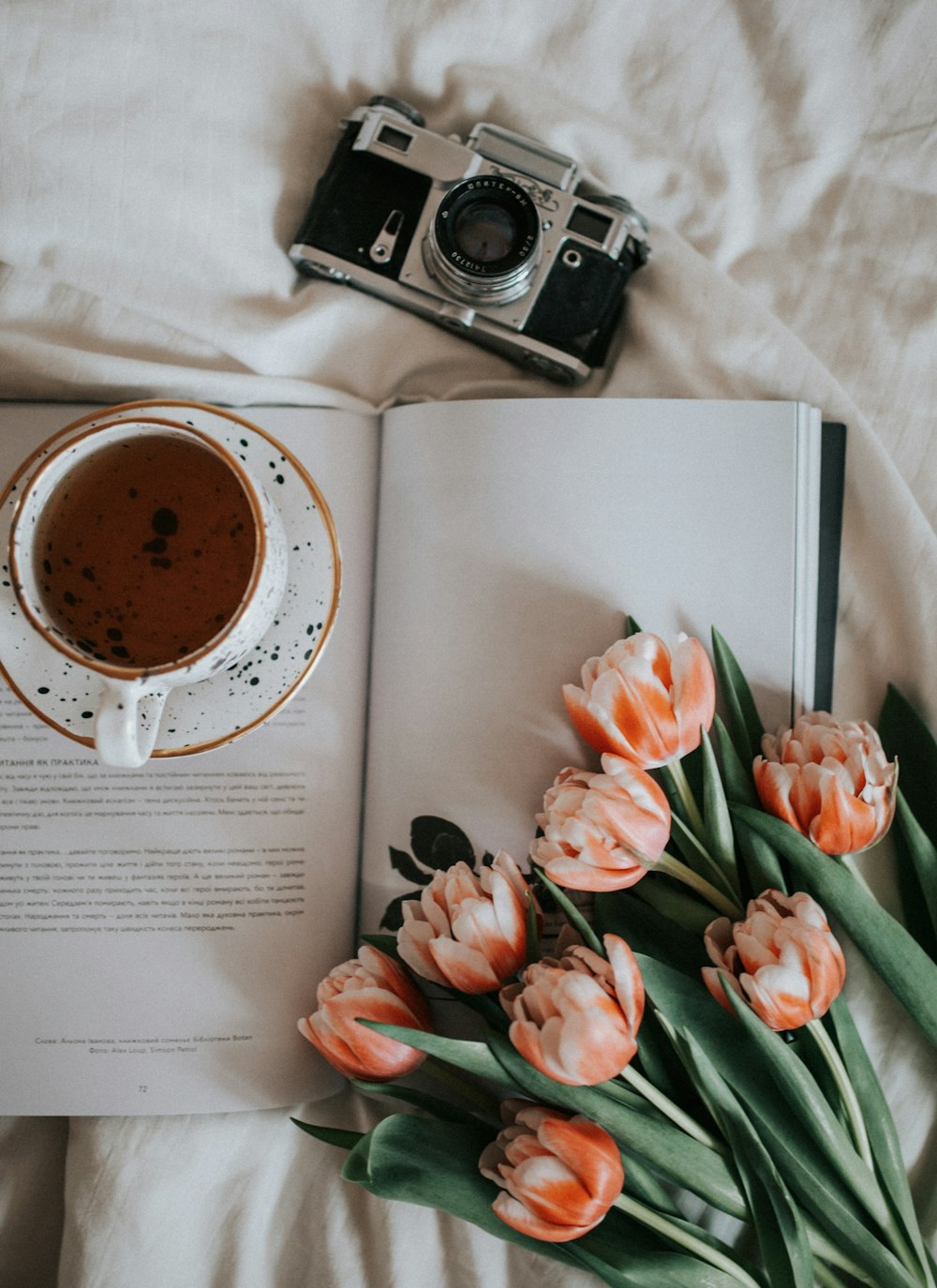 white ceramic mug on white book page