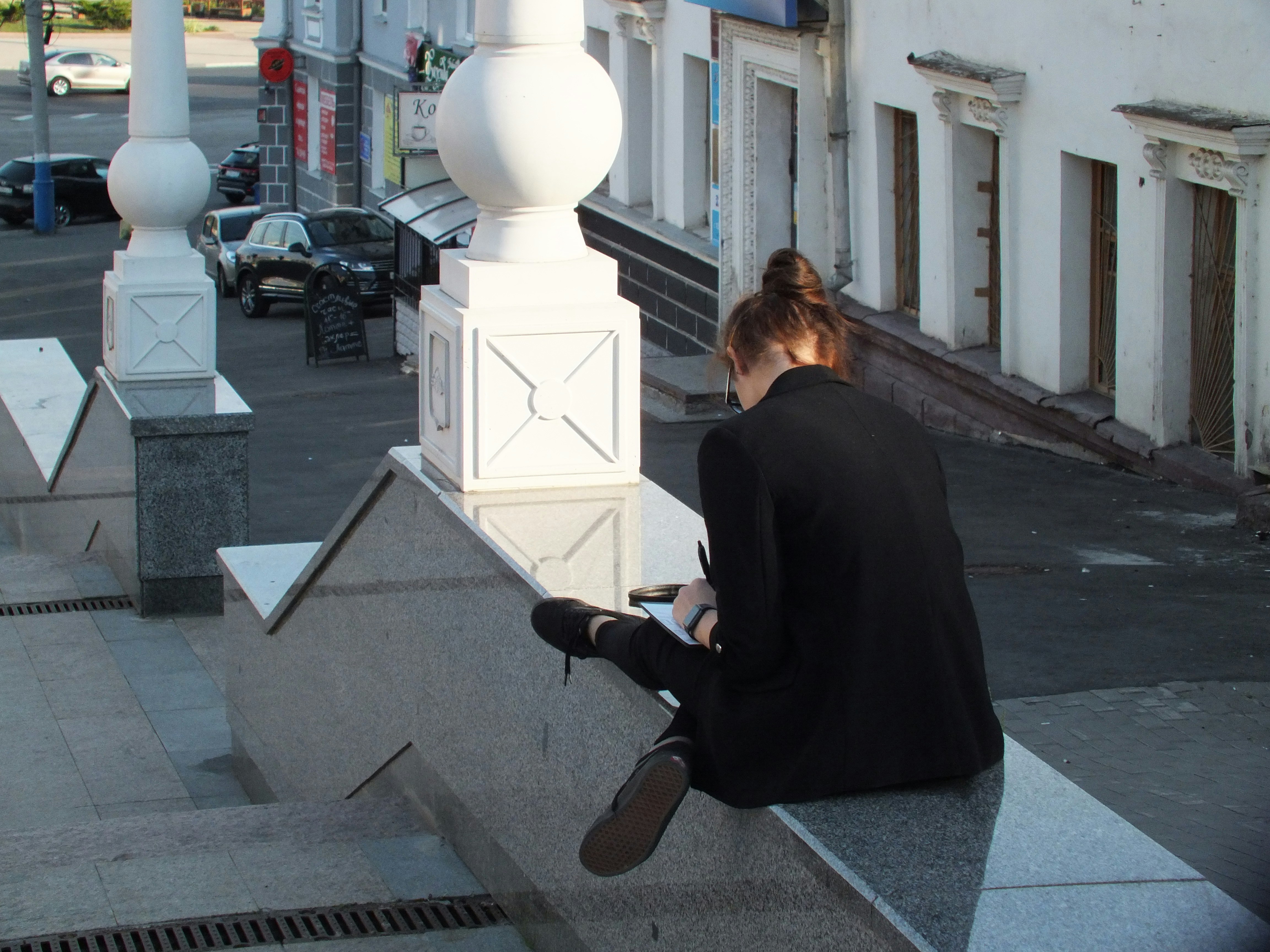 Person setting up an outdoor WiFi extender
