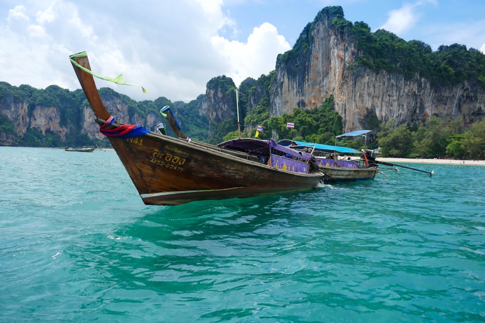 brown boat on body of water during daytime