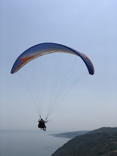 person in parachute during daytime